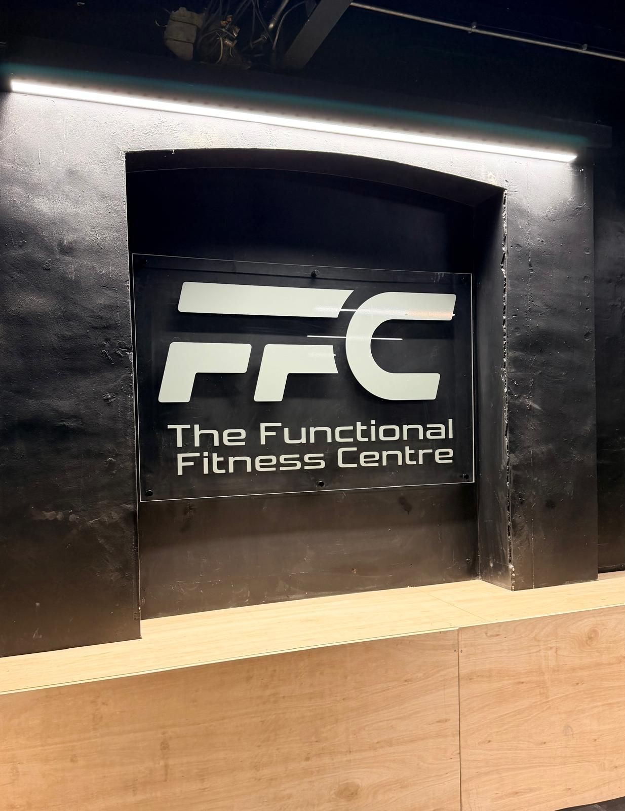 A black and silver sign for