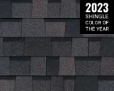 A dark, textured roofing shingle pattern in gray and black, labeled as the 2023 Shingle Color of the Year.