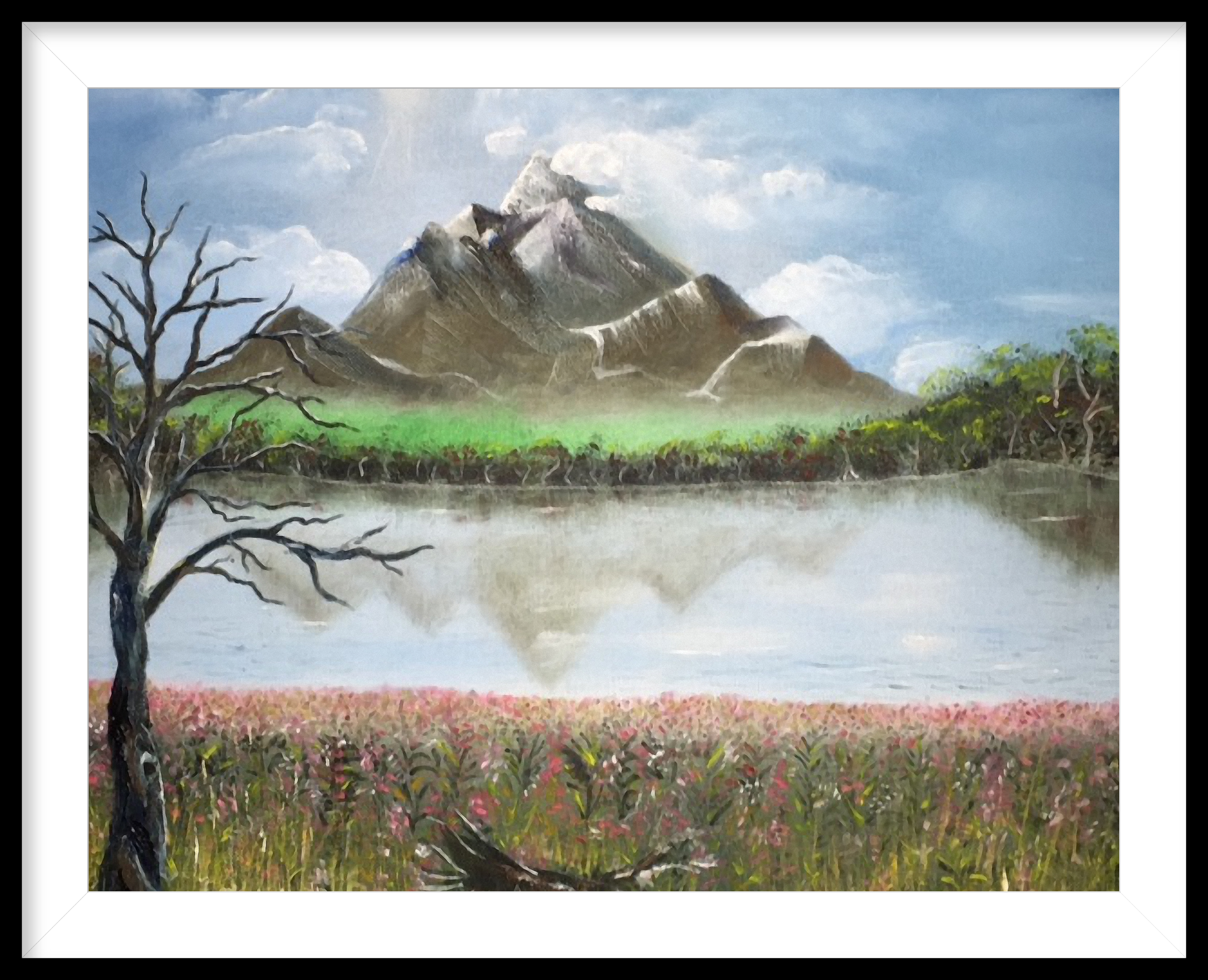 Mountain range reflected in calm water, with a field of flowers and a bare tree.