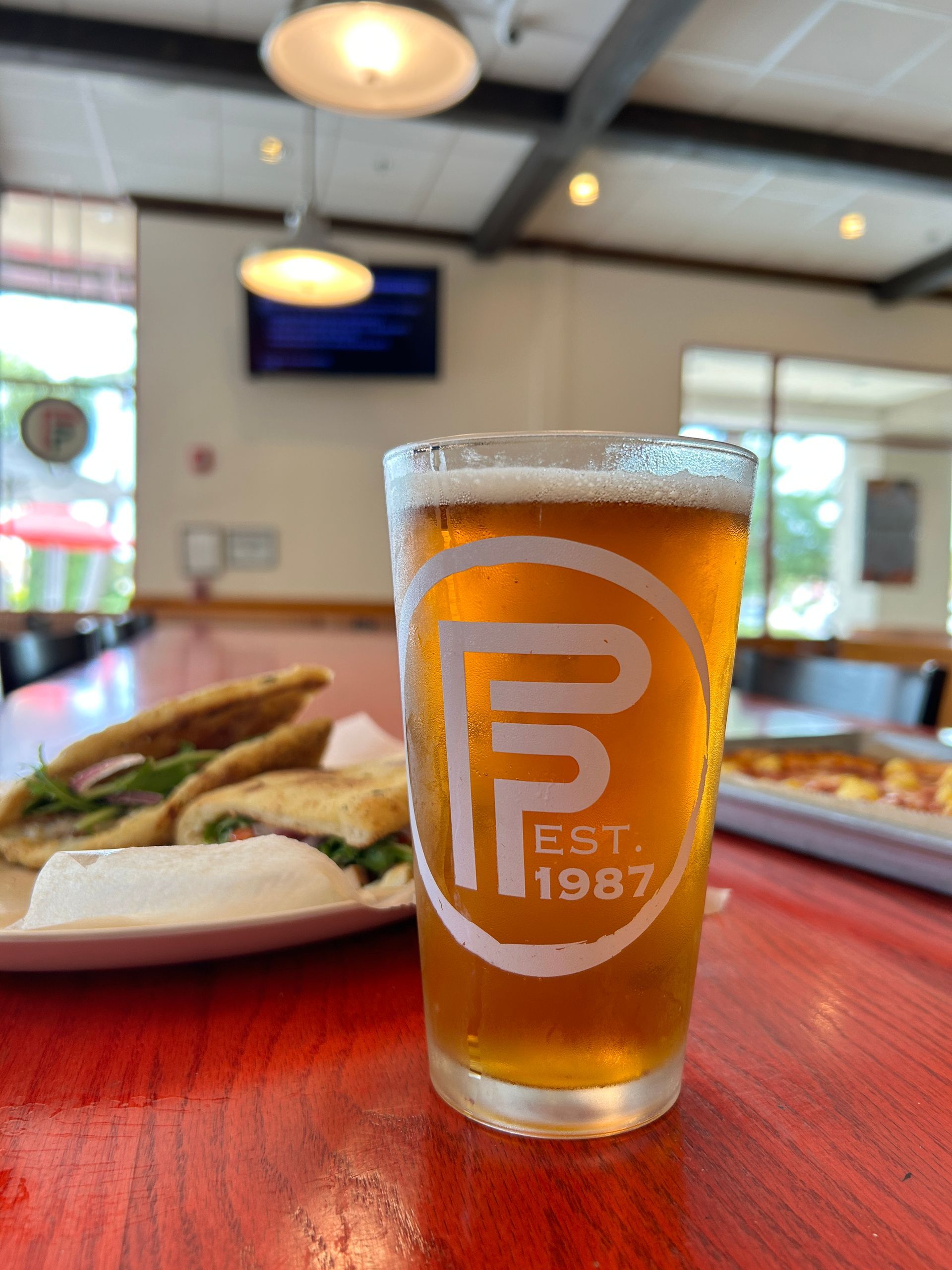 Flippers Pizza Co Handhelds with a Craft Beer