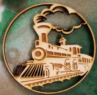 Vintage steam train logo in tan within a circular border, billowing smoke over tracks.