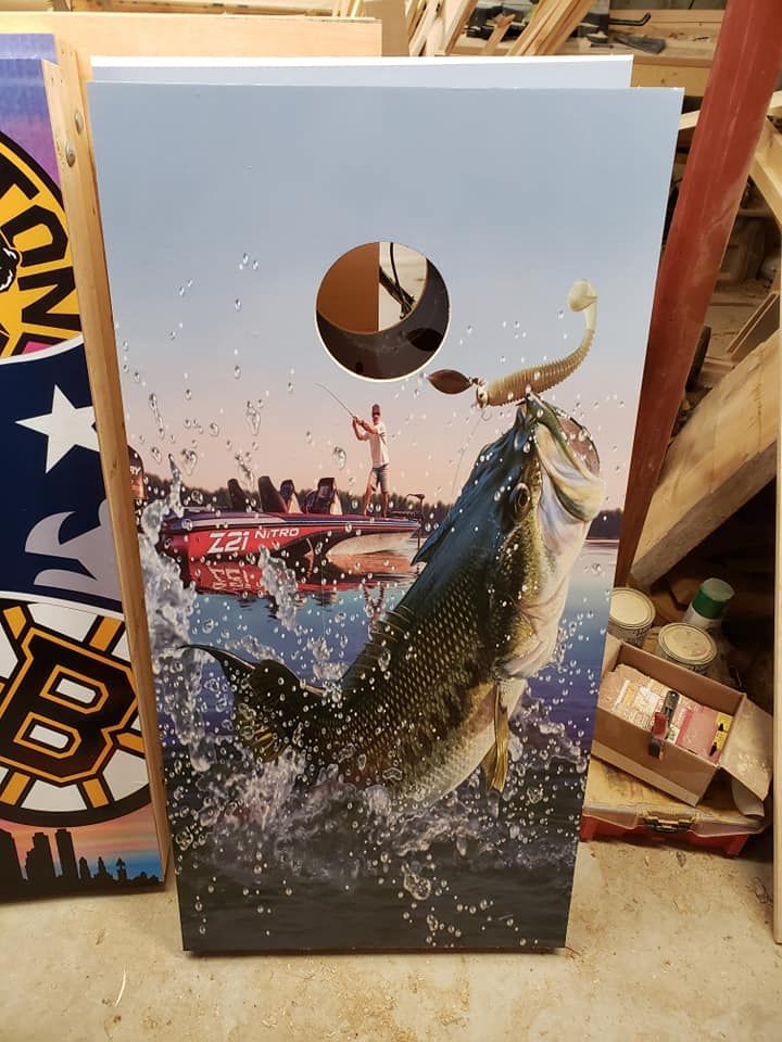 Poster of a leaping fish splashing from water, with a fishing boat and sunrise in the background.