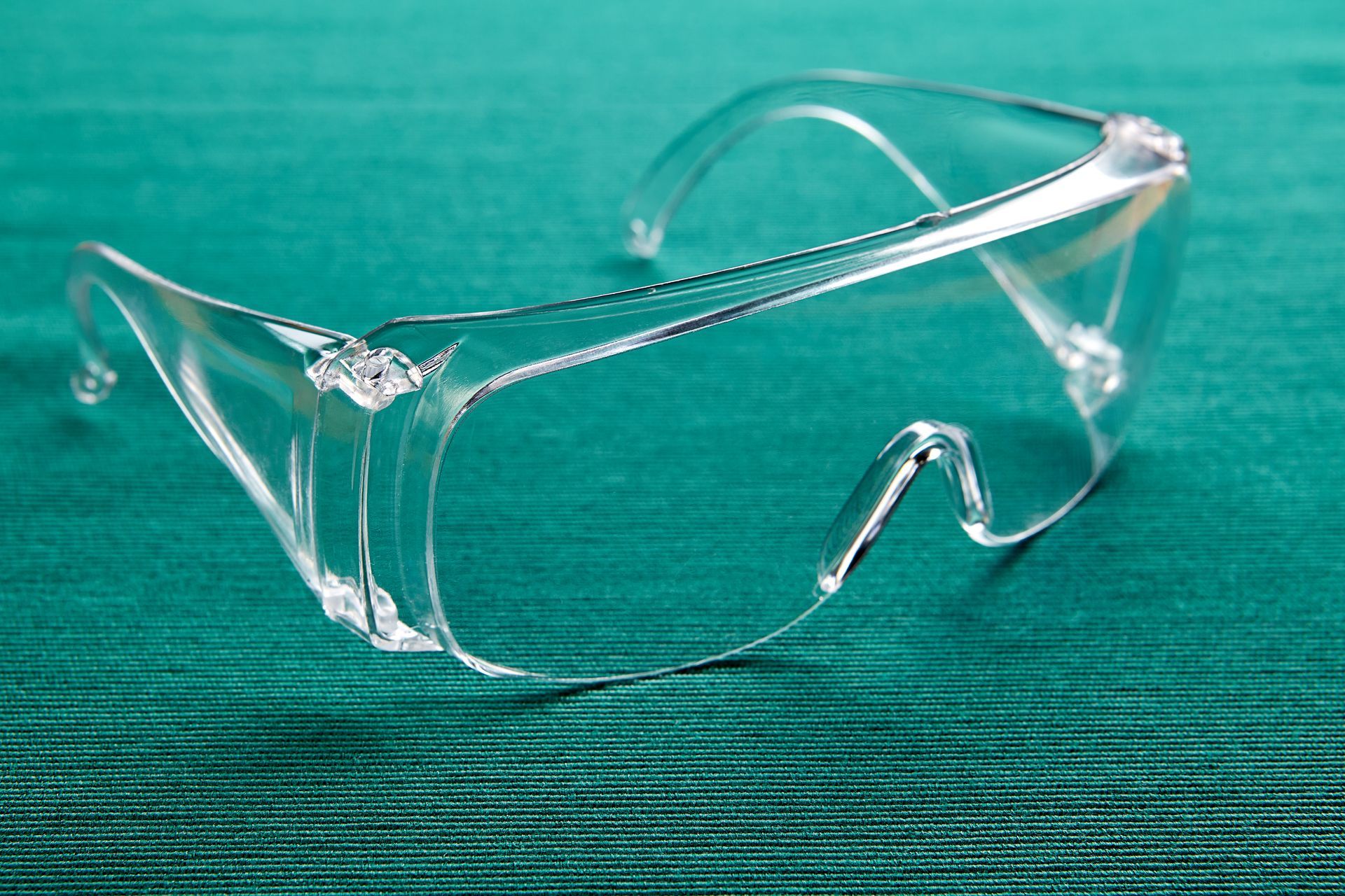 Lab goggles on a blue textures surface