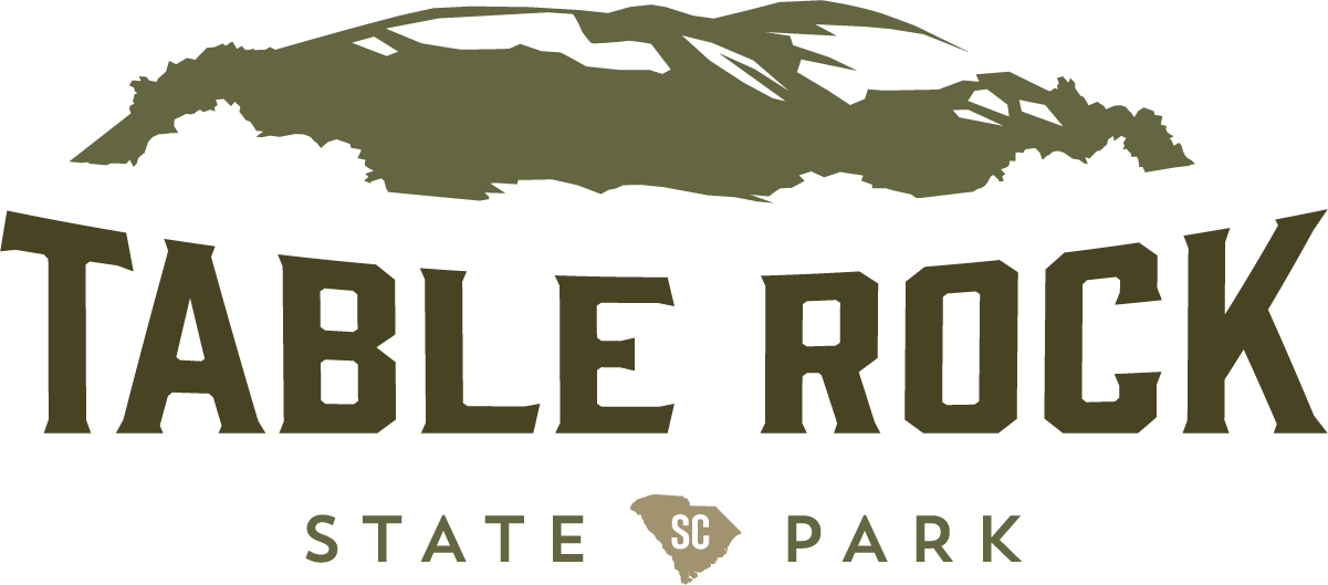 A logo for table rock state park with a mountain in the background