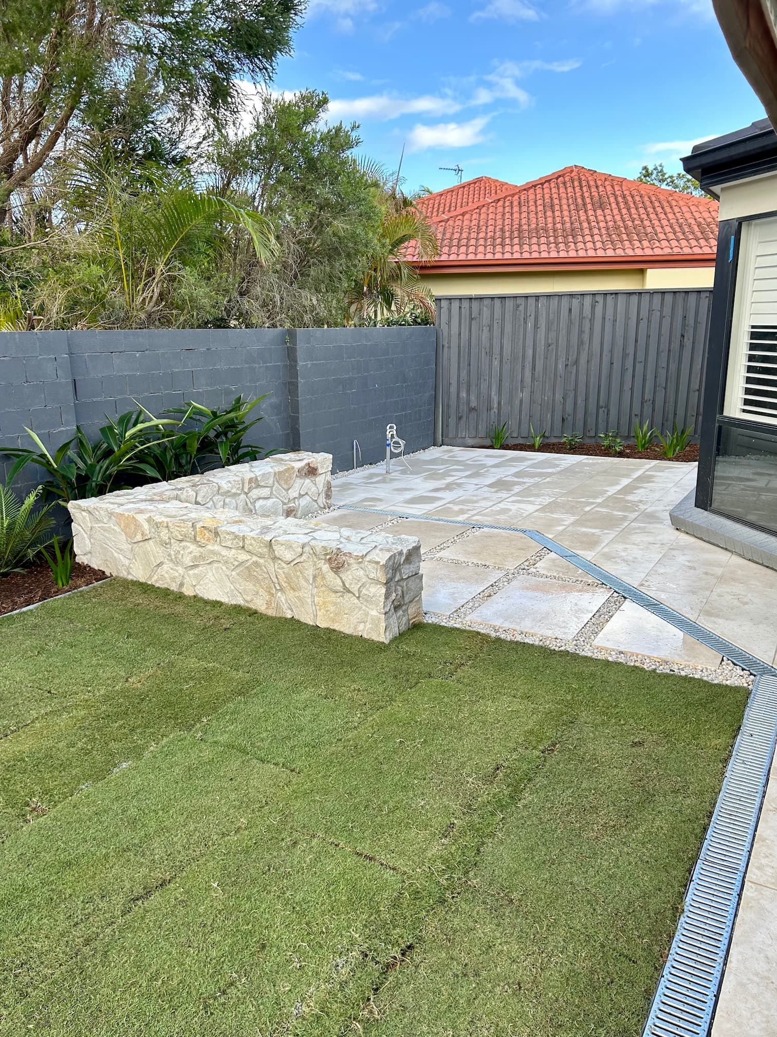 Stone cladding covering an outdoor bench seat