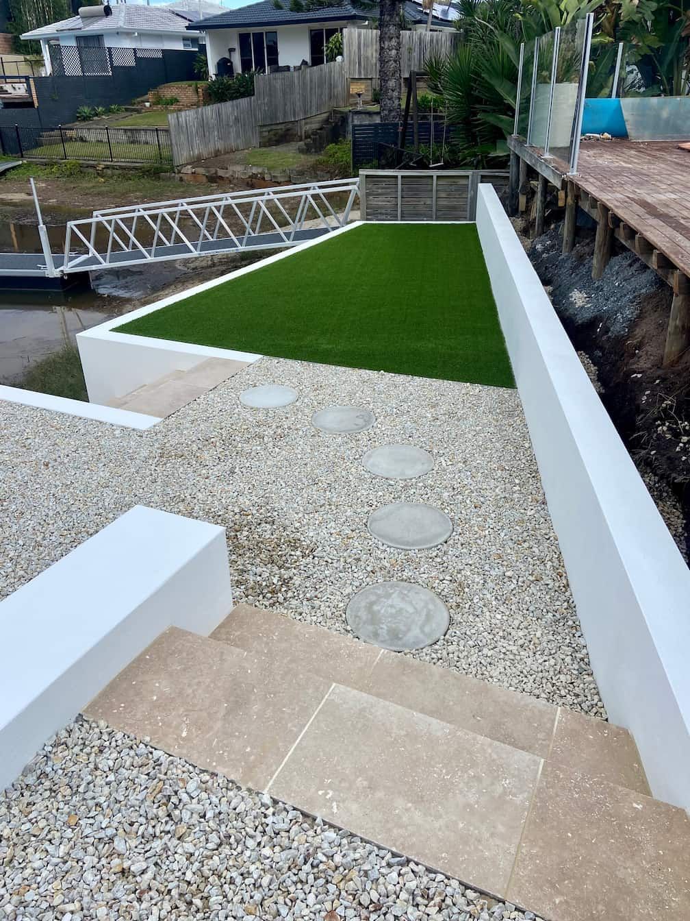 an artificial turf area with steps leading up to it