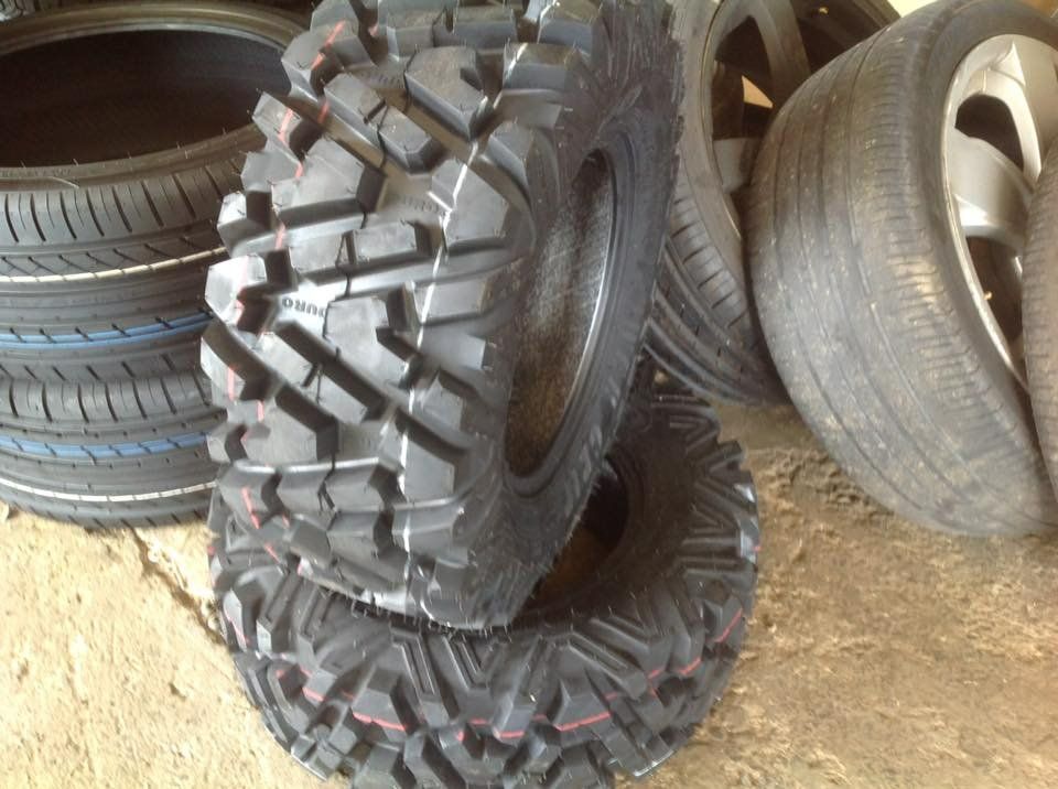 A Bunch of Tires Are Stacked on Top of Each Other — Modern Motors-Nabiac in Nabiac, NSW