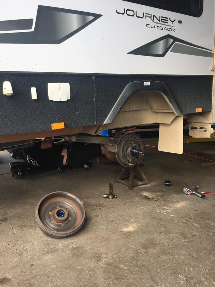 A caravan is being repaired in a garage — Modern Motors-Nabiac in Nabiac, NSW