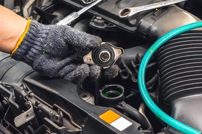 A Person Is Working on A Car Engine with A Wrench — Modern Motors-Nabiac in Nabiac, NSW