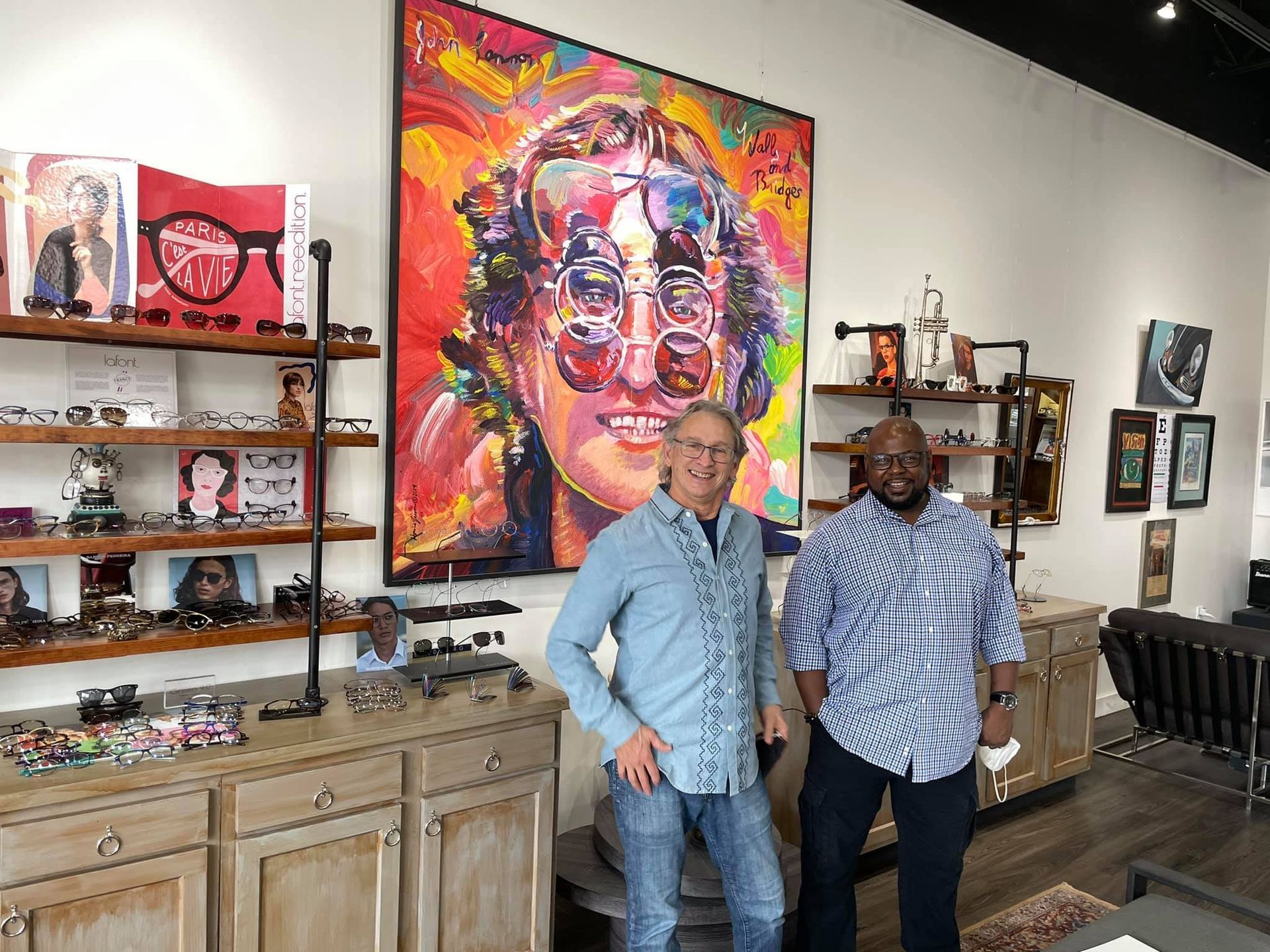 Gregor Owen and Dominic McCoy standing in CustomEyes shop, smiling at camera. 5 Years of CustomEyes