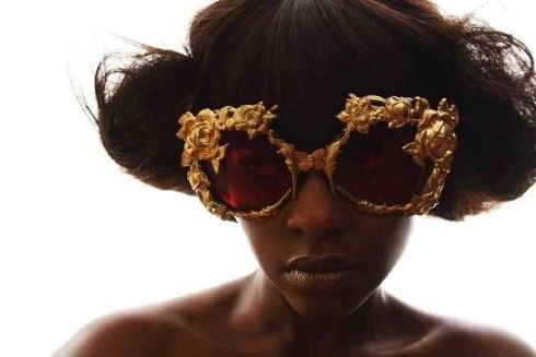 Woman wearing ornate wooden frames