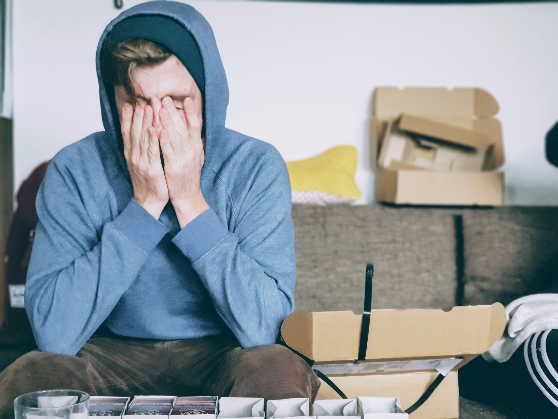man rubbing face from a headache