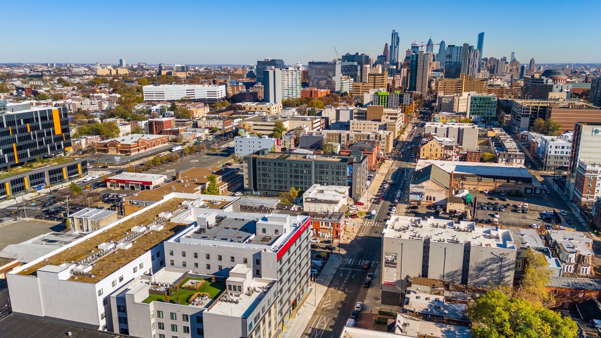 An aerial view of a city with a lot of buildings and trees.
