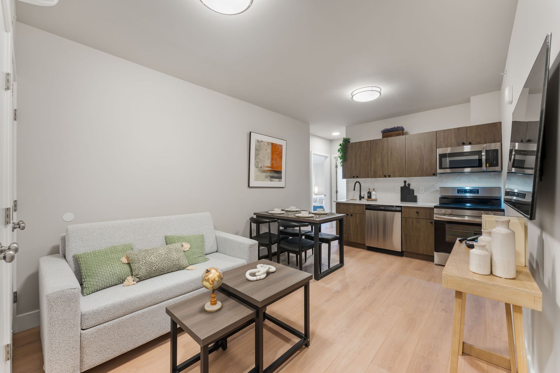 A living room with a couch and two coffee tables