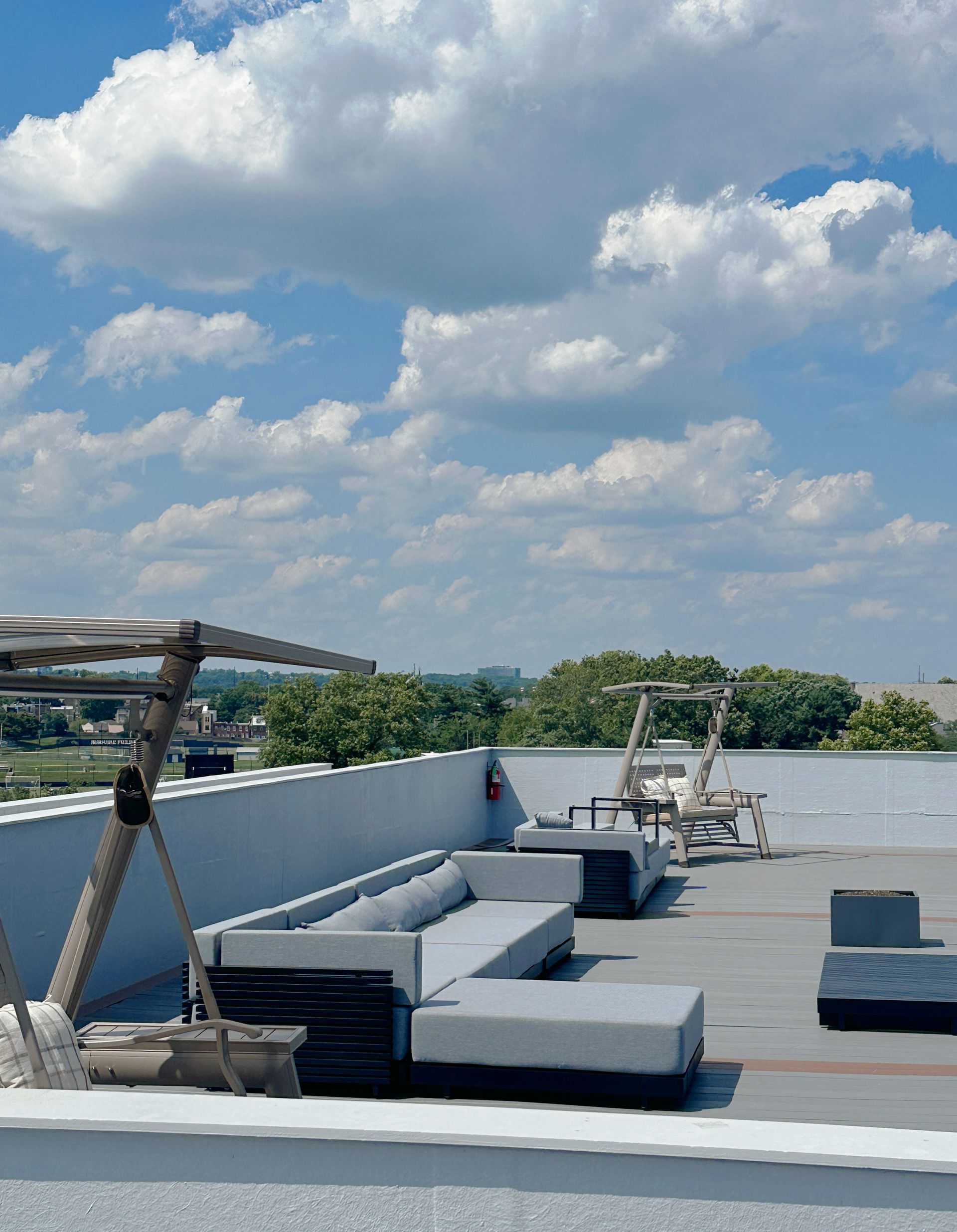 A rooftop with a lot of furniture on it