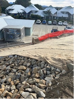 Pile of Rocks Under Beige Sheet — Michael Flick Horticulture in Coffs Harbour, NSW