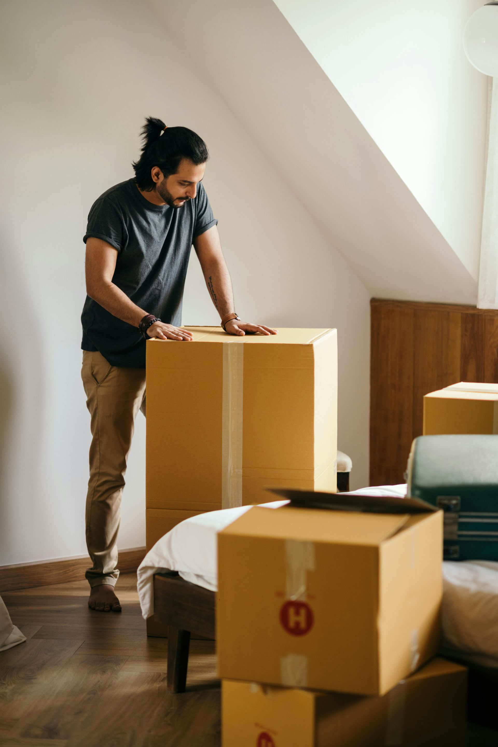 man with holding box upright