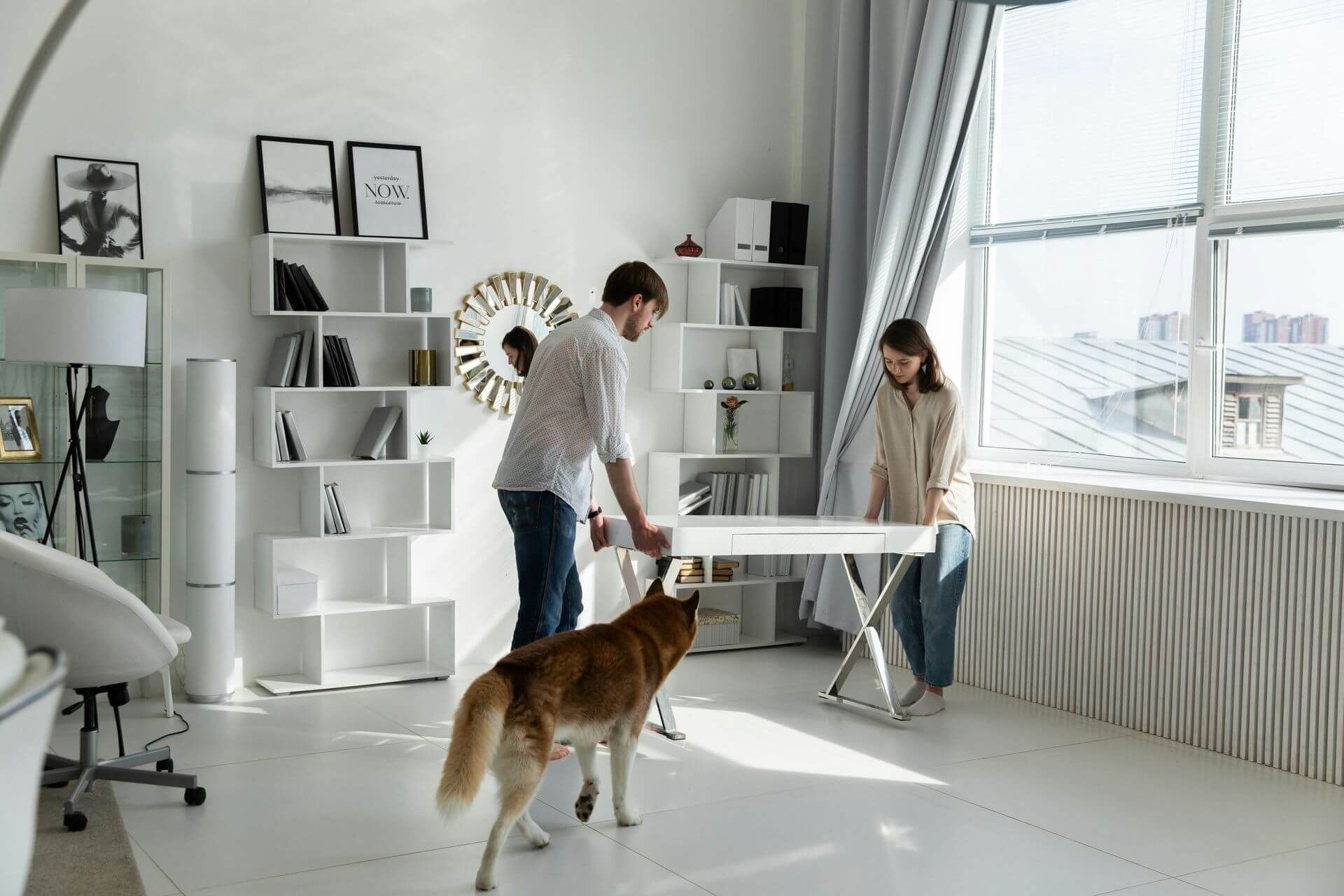 woman and man relocating table