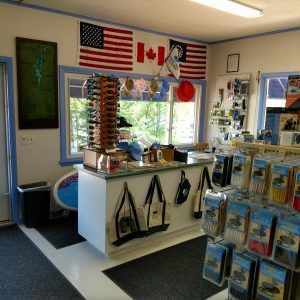 A store with a canadian flag and american flags on the walls