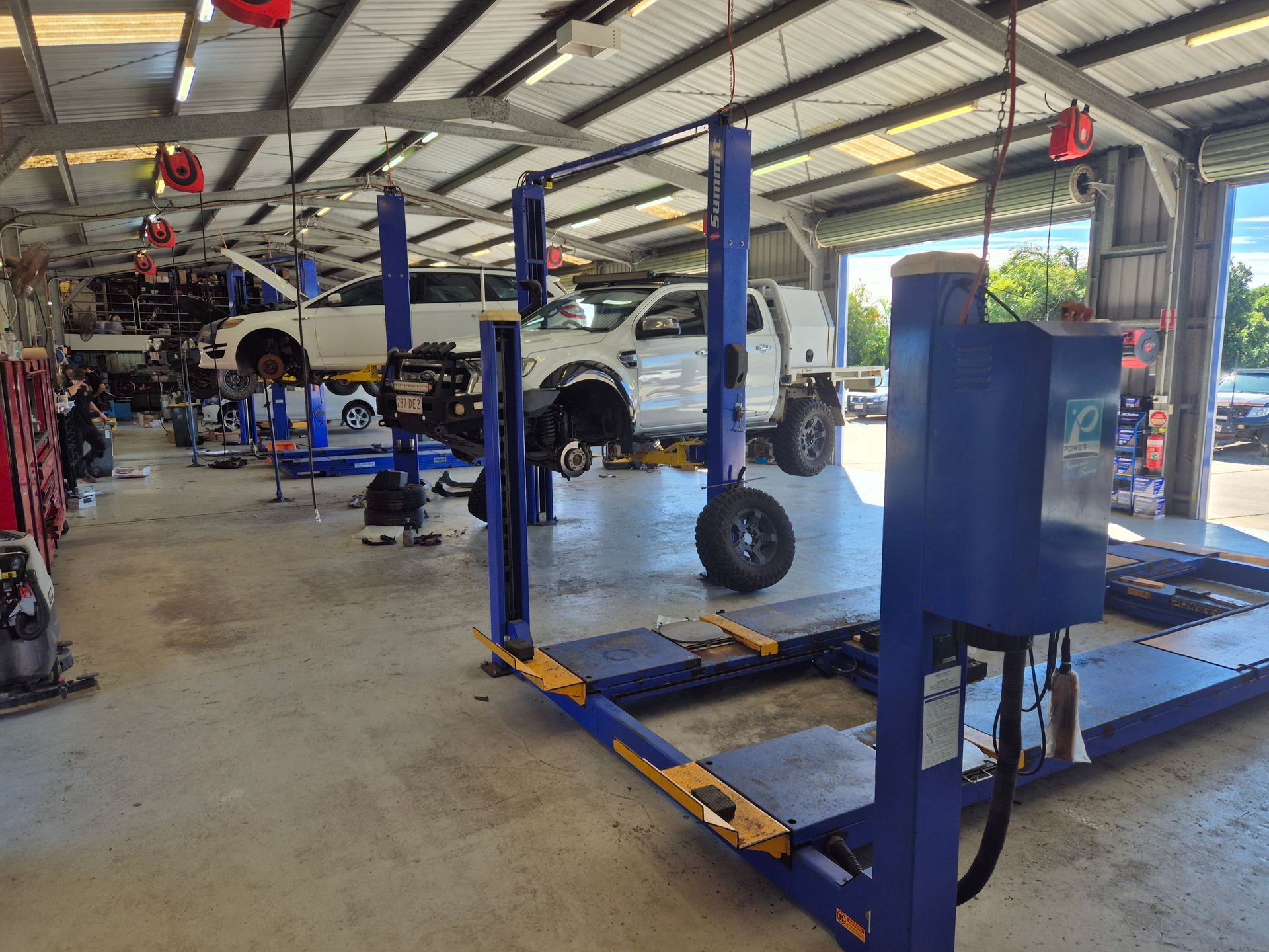Auto Repair Shop With Car Lifts, a White Truck — Emu Park Automotive and Tyre Service in Emu Park, QLD