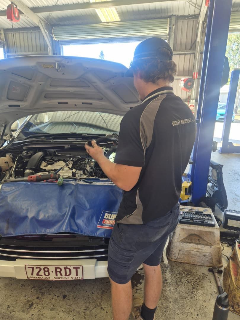 Mechanic Inspecting a Car Engine in a Workshop — Emu Park Automotive and Tyre Service in Emu Park, QLD