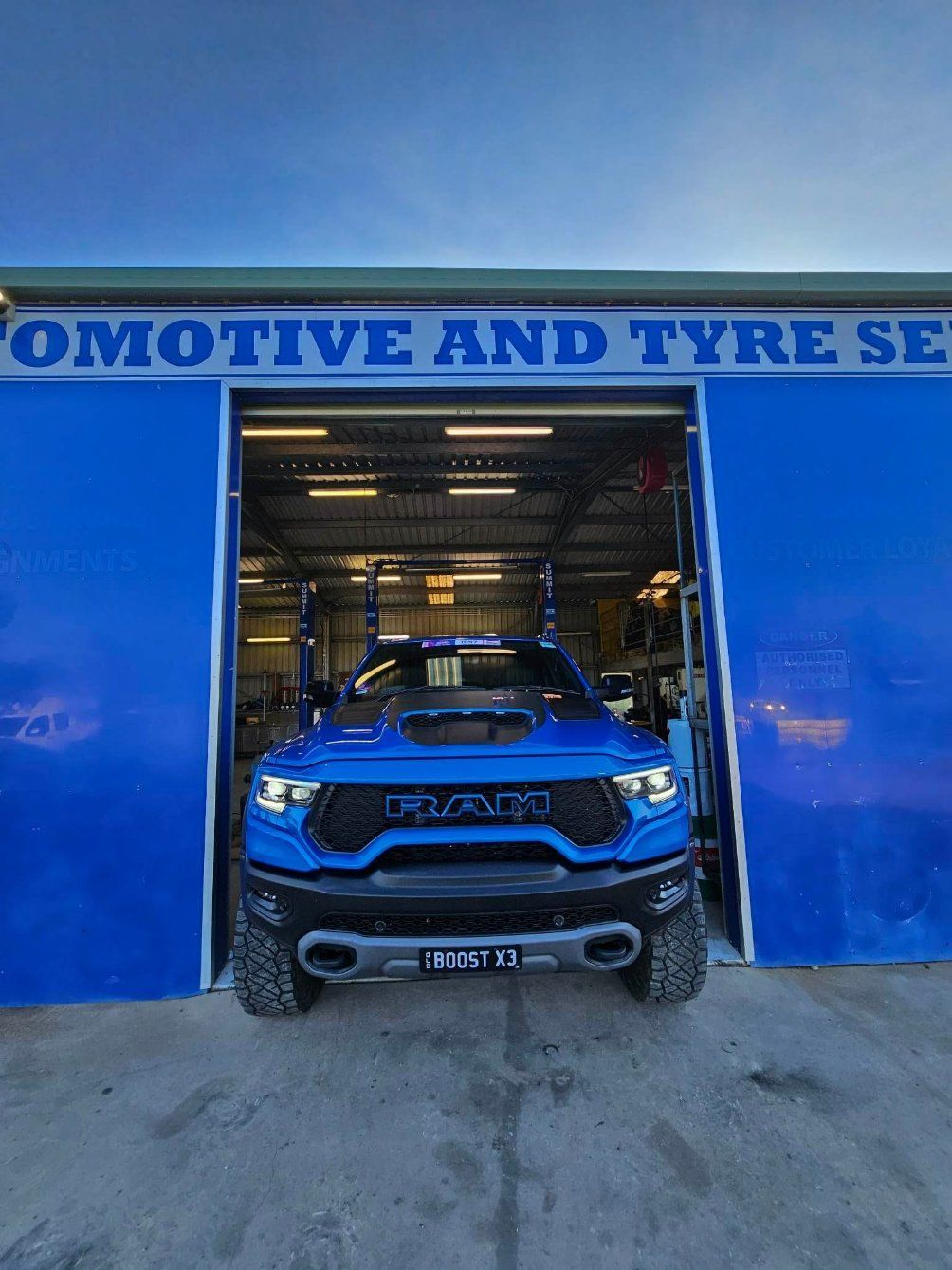 Blue Off-road SUV in a Garage Entrance — Emu Park Automotive and Tyre Service in Taroomball, QLD