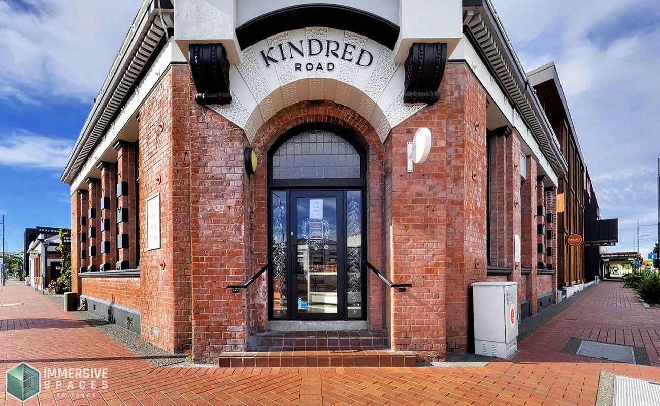 Brick building with arched entrance reading