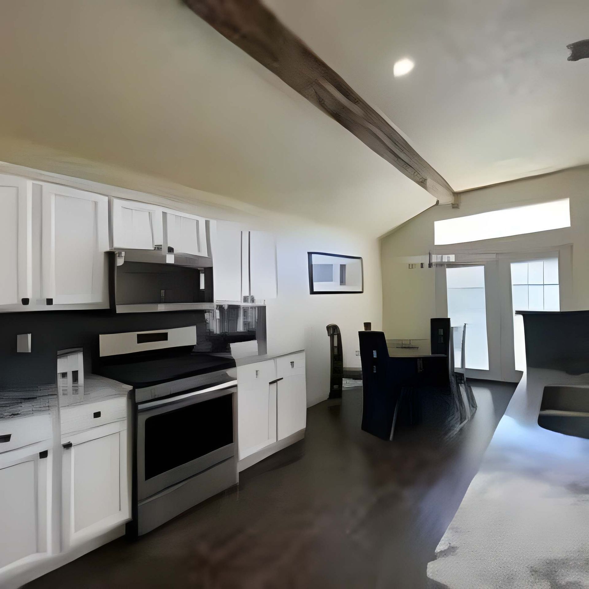 Modern open-plan kitchen and dining area with white cabinets, dark wood floors, and vaulted beam ceiling