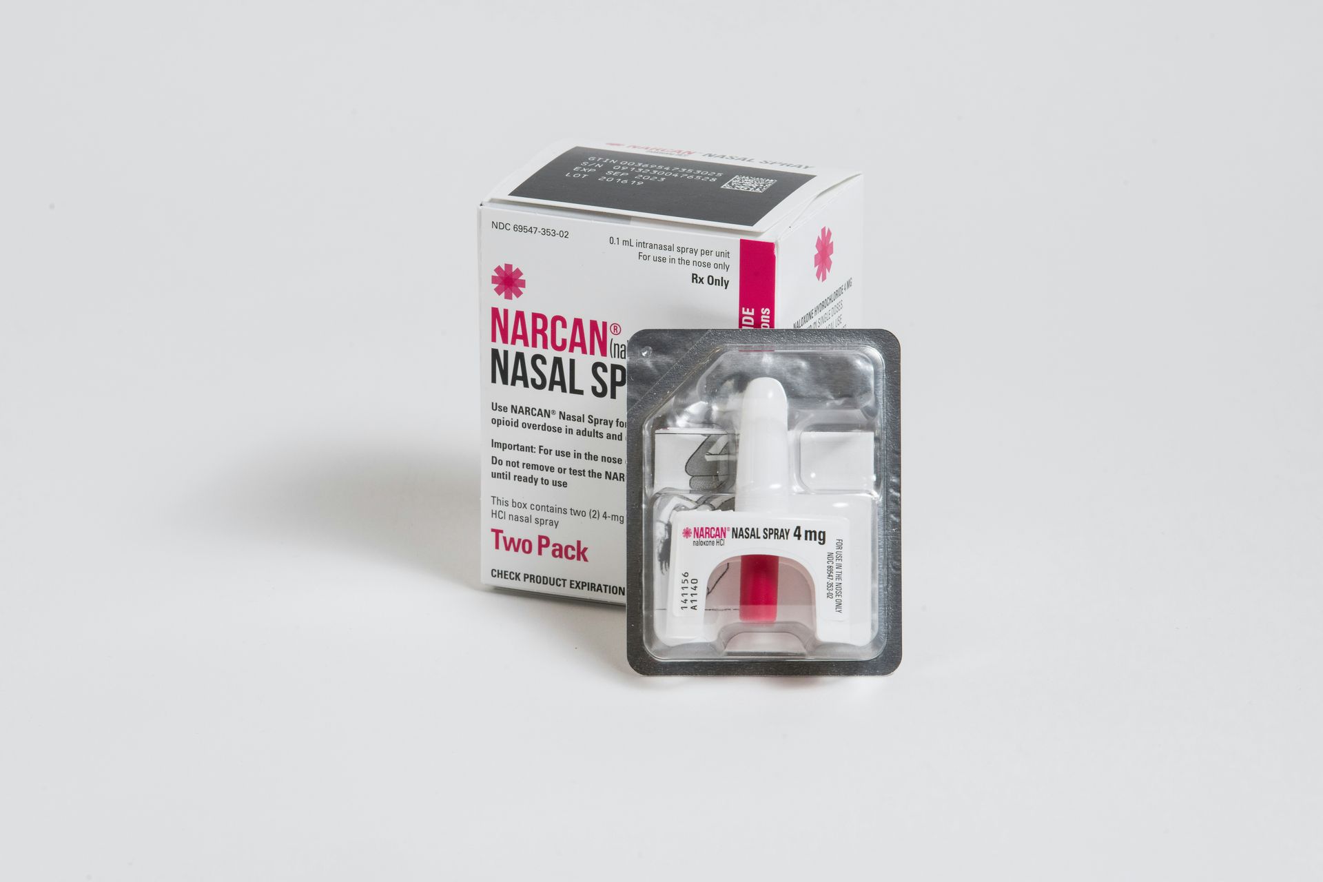 Narcan nasal spray box and blister pack on a white background