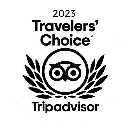 Travelers' Choice award logo from TripAdvisor for 2023, featuring an owl in a circle, surrounded by leaves.