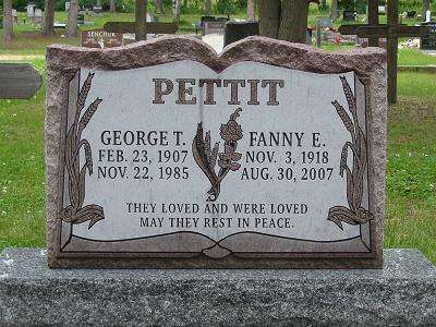 Pettit family gravestone in a cemetery, with engraved names and dates on a gray stone marker.