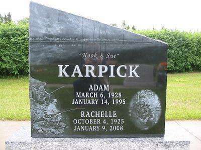 Black granite gravestone engraved with 