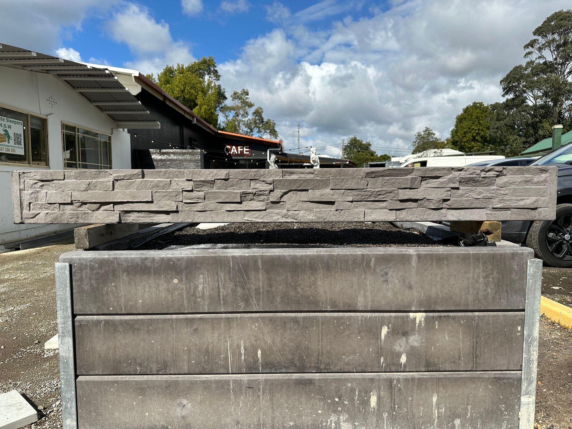 Stone-textured Ledge on a Concrete Block Outdoors — Concrete Sleepers NSW - Port Macquarie in Sancrox, NSW