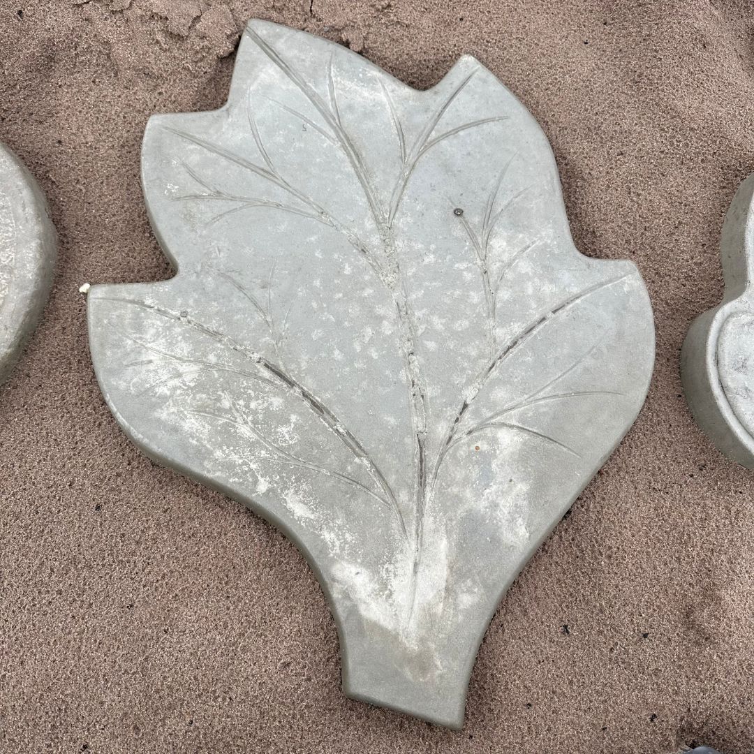 Leaf-Shaped Gray Concrete Paver on Sand, With Etched Leaf — Concrete Sleepers NSW - Port Macquarie in Central Coast, NSW