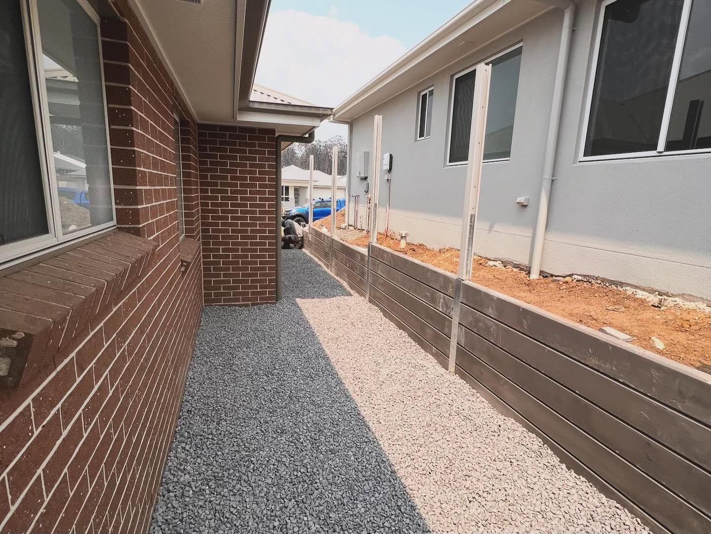 Narrow Gravel Side Yard Between Brick House — Concrete Sleepers NSW - Port Macquarie in Central Coast, NSW