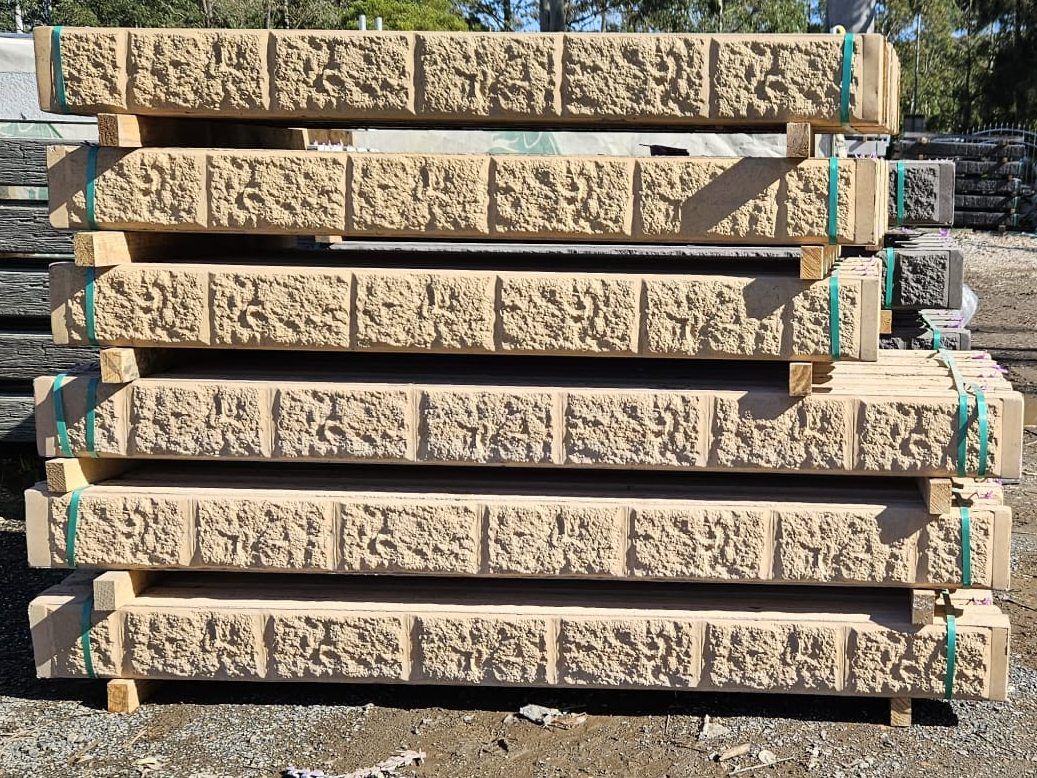 Stacked Beige Stone Retaining Wall Blocks, Secured — Concrete Sleepers NSW - Port Macquarie in Sancrox, NSW