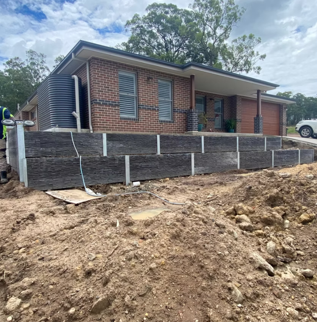 House With a Multi-level Timber Retaining Wall, Built — Concrete Sleepers NSW - Port Macquarie in Sancrox, NSW