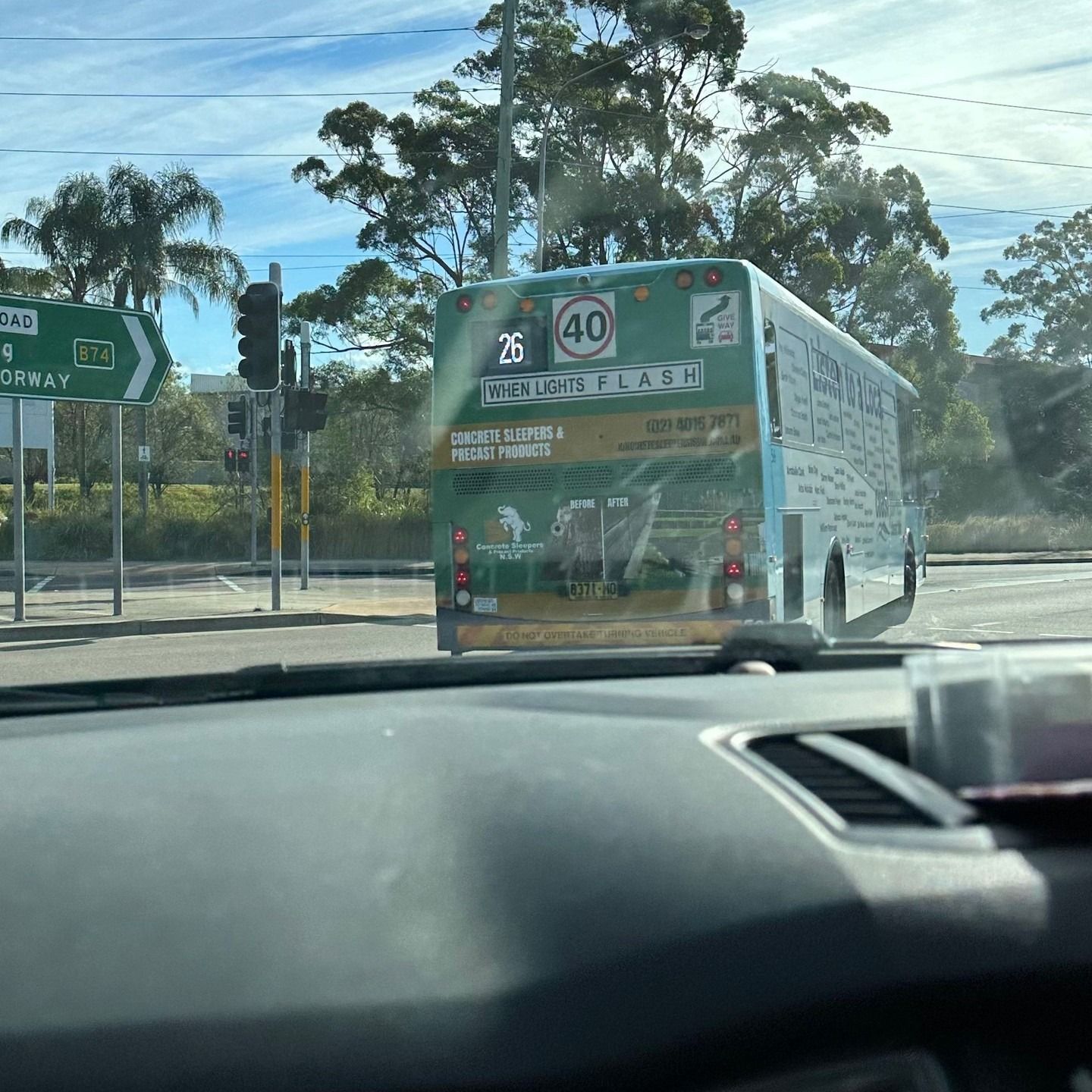 Green Bus at a Crossroad, Showing a Speed Limit of 40 Km/h — Concrete Sleepers NSW - Port Macquarie in Sancrox, NSW