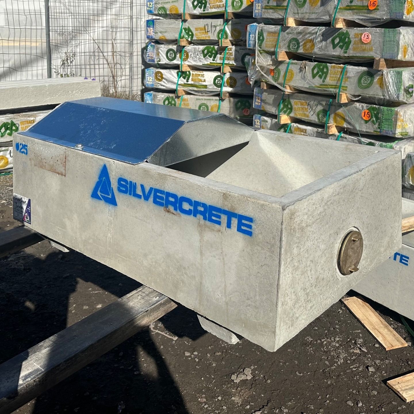 Concrete Trough With Angled Metal Top, Silvercrete Logo, Outdoors — Concrete Sleepers NSW - Port Macquarie in Sancrox, NSW