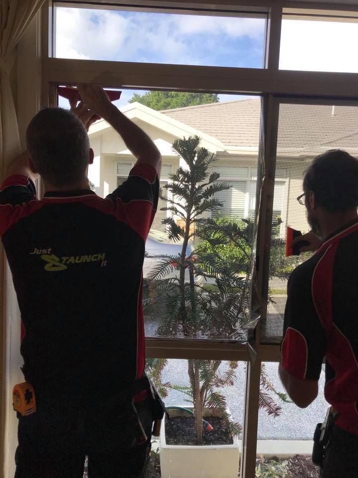 Two Men in Staunch Window Tinting Uniforms Are Installing Window Tint in Ballina