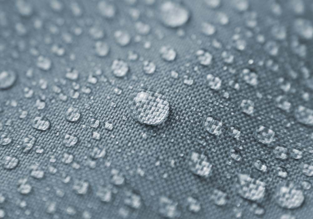 A Close Up Of Water Drops On A Fabric — Staunch Window Tinting In South Lismore, NSW