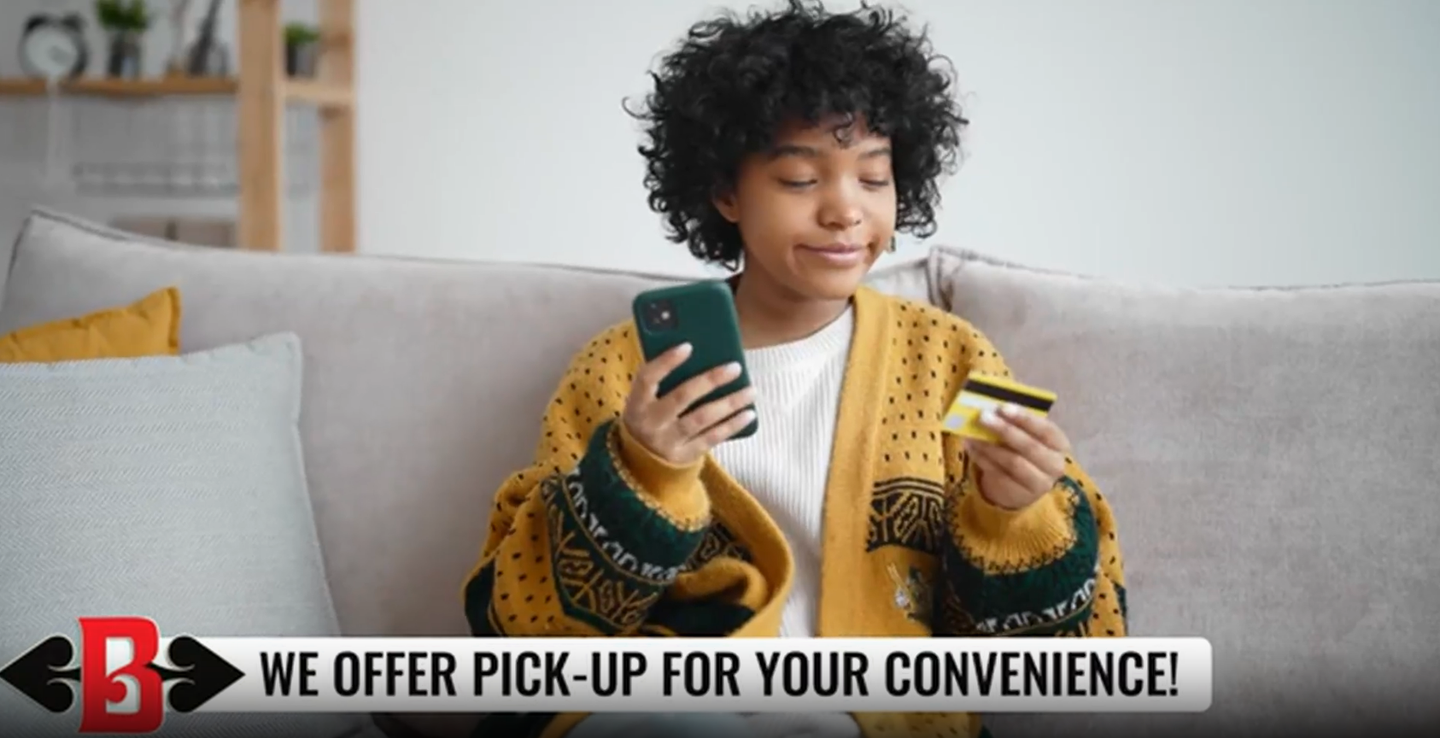 Person on a couch holding a phone and card with banner text: “WE OFFER PICK-UP FOR YOUR CONVENIENCE!”