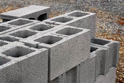 Gray concrete blocks stacked together outdoors.