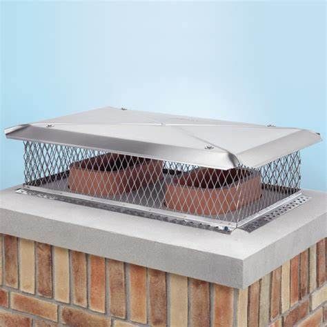Chimney cap with mesh screen and metal cover on brick chimney.