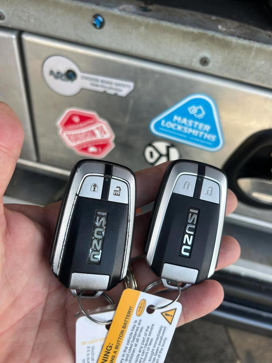 Car Locksmith In Port Macquarie Holding Smart Keys
