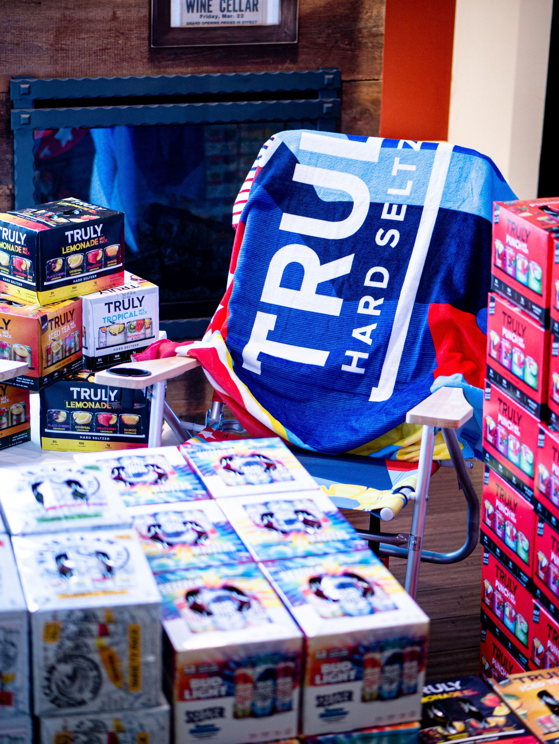 TRU Hard Seltzer display with stacked boxes and branded blue bag in a store aisle