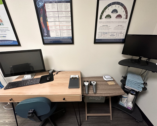 A desk with two monitors and a keyboard on it