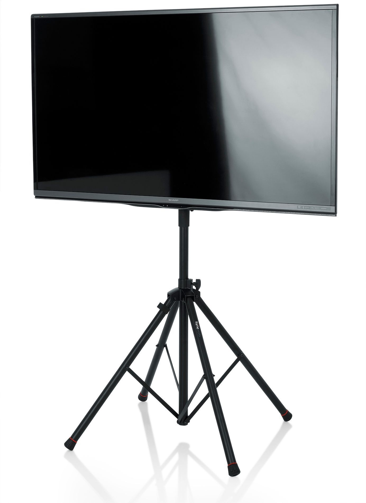 Black flat-screen TV on a black tripod stand, against a white background.