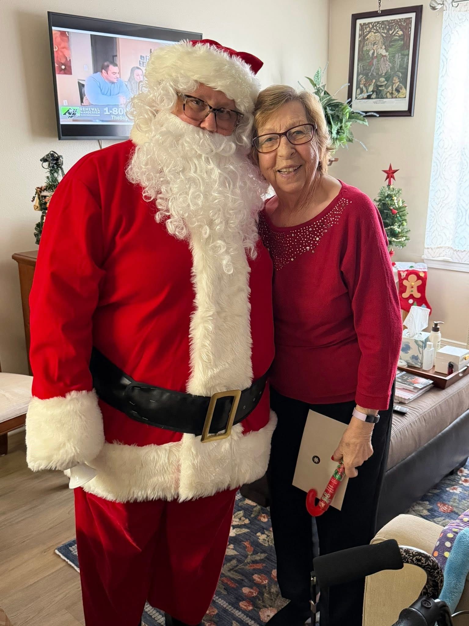 ville ste marie resident with Santa Claus