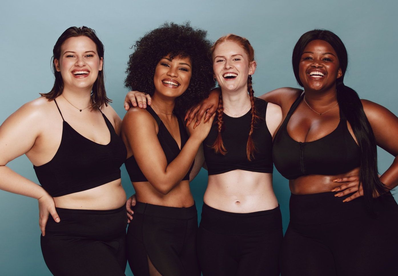 A group of women are posing for a picture together.